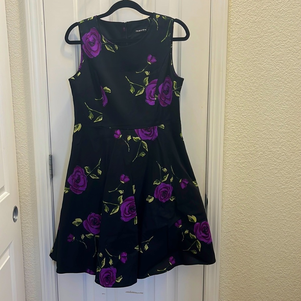 Knee length floral dress featuring purple roses. will typically fit size 8 to 10